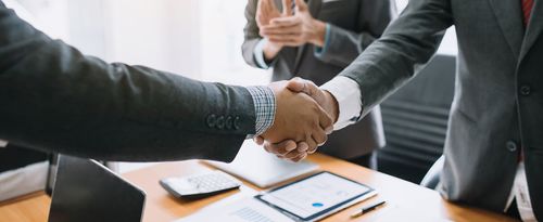 Business people shaking hands.