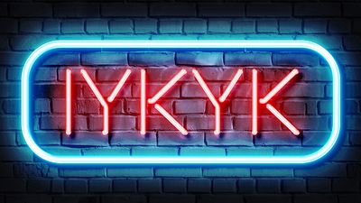 A neon sign saying "IYKYK" (If You Know You Know), illustration on a dark brick background. (Gen Z slang, abbreviations, computer rendered illustrations, inside joke)